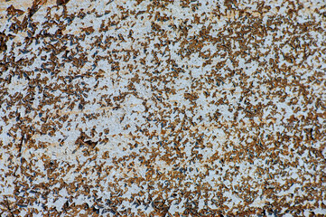 surface of the old metal wall plaster with traces of decaying paint.