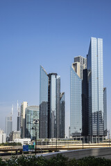 Obraz premium Dubai Modern architecture. Dubai is most populous city and emirate in UAE, and second largest emirate by territorial size after capital - Abu Dhabi. Dubai, United Arab Emirates.