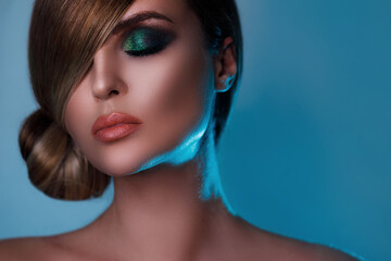 Naklejka premium Sexy model in stylish image with sleek hair covering one eye and beautiful green eyeshadows on another
