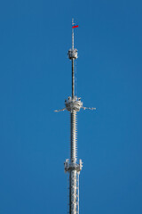Ostankino Television Tower close up, Moscow, Russia. Russian TV and Radio Broadcasting Network. Russian flag on the Ostankino tower.