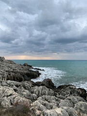 Sunset time at the sea, cloudy evening sky