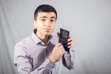 holding an empty wallet