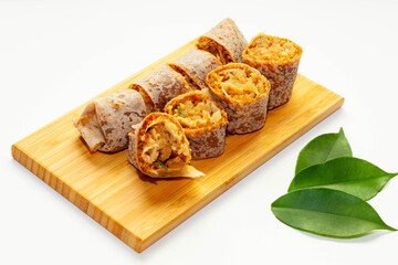 Soft skin spring roll on chopping board with white background