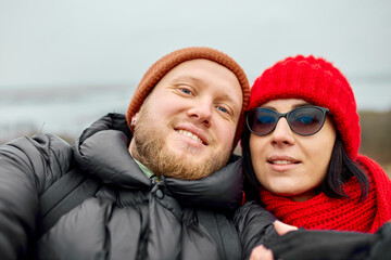 Couple travelers tourists take selfie at foggy river landscape