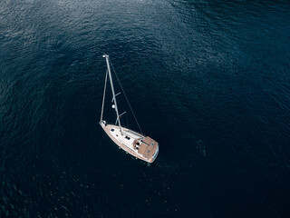 Top view of a sailing yacht sailing on the sea.