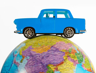  yellow taxi car - metal toy model - on globe  isolated on white  background. empty copy space for...