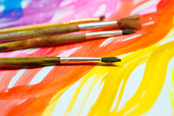 Background from colored undulated lines, pattern made from watercolor paints, top view
