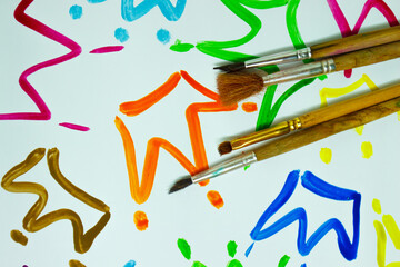 Pattern from colored painted crowns, background from watercolor paints