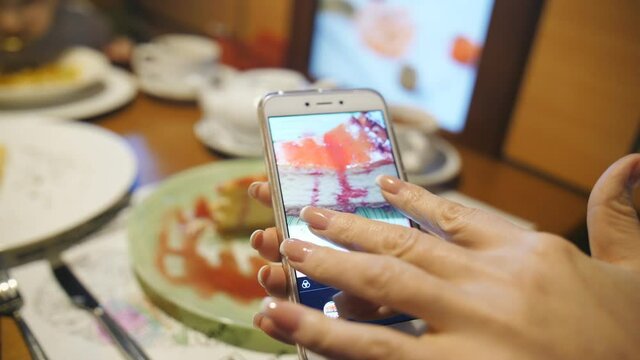 Woman Hands Taking Picture Of Sundae Dessert With Smartphone.