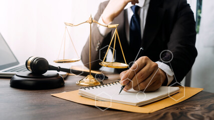 Business and lawyers discussing contract papers with brass scale on desk in office. Law, legal...