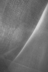 Metal mesh texture on a black background