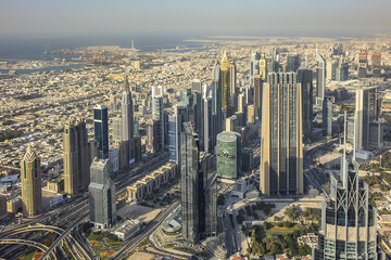 Naklejka na ściany i meble Aerial view of Dubai from Burj Khalifa - tallest skyscraper in the world. DUBAI, United Arab Emirates. 