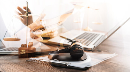 Business and lawyers discussing contract papers with brass scale on desk in office. Law, legal services, advice, justice and law concept picture with film grain effect