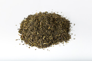 Pile of green tea isolated on white background