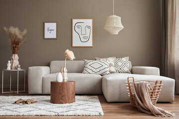 Interior design of stylish living room with modern neutral sofa, mock up poster farmes, dried...