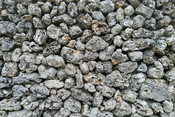 Coral rock wall in Penghu, Taiwan. the walls are made of either dead coral, basalt, or a mixture of both