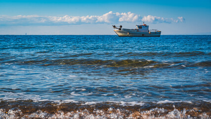 isolated small boat in the sea