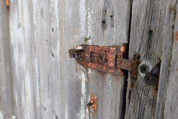 wooden door. old rusty lock, bolt