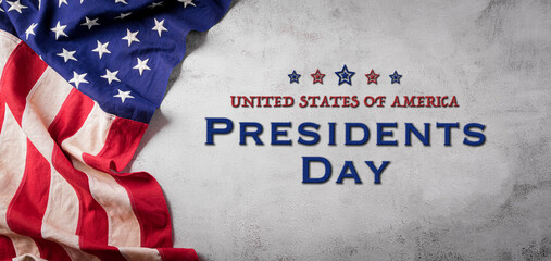 Happy presidents day concept with flag of the United States on old stone background.