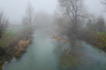 Misty river landscapes of the River Tove in England on a winter's day. 