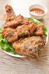 batter fried slice mango or red Tilapia fish with chop garlic dipping spicy sauce 