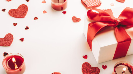 Winter valentines. Red love hearts, romantic gift box, candle on white background. Sainte Valentine, mothers day, birthday greeting cards, invitation, celebration concept.