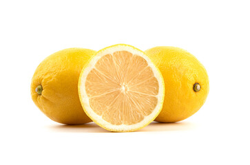 Obraz na płótnie Canvas Half a lemon and two whole fruits on a white background.