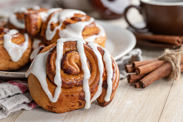 Baked Cinnamon Roll With White Icing - 409013091