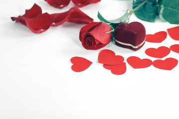 ring in red box with a red rose on the white background
