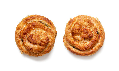 Top view of two puff pastry buns, with a golden crispy crust on a white background