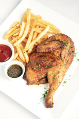 roast rotisserie half chicken with french fries simple meal - 409015252