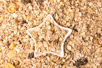 old country style muesli background, star-shaped bowl.