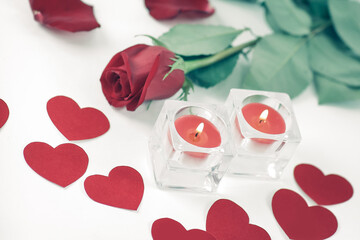 Fototapeta na wymiar romantic concept .burning candle and red rose . photo with copy