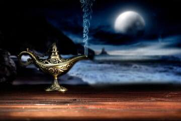 Magic lamp on a wooden table in the dark night 