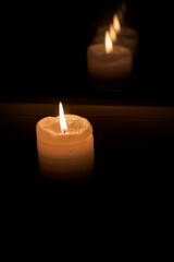 Burning flame on a cylindrical candle.