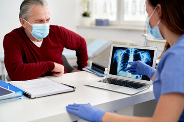 Doctor analyzing the patient's lung X-rays