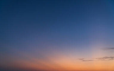 Evening sky on twilight background with colorful sunset cloud fluffy orange sunlight, Dusk sky nature background 