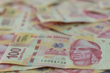 selective focus to mexican 100 peso bank notes