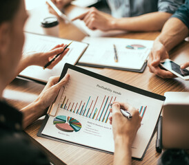 close up. employees discussing financial documents at the workplace.