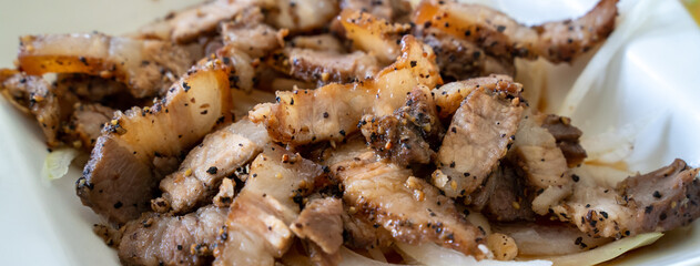 Delicious Taiwanese salted pork food with onion in restaurant.