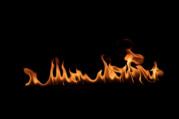 Abstract blaze fire flame texture for banner background.Texture of fire flames  on a black background. Real fiery bonfire for creative design elements