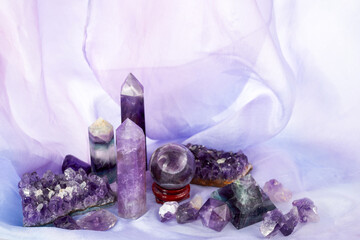 Crystals for healing, tortune telling and astrology. Set of amethyst crystals on purple background