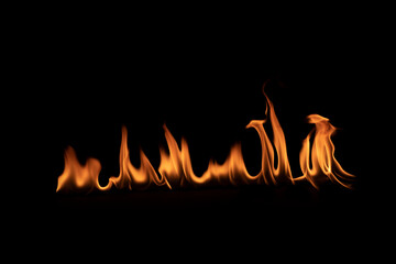 Abstract blaze fire flame texture for banner background.Texture of fire flames  on a black background. Real fiery bonfire for creative design elements