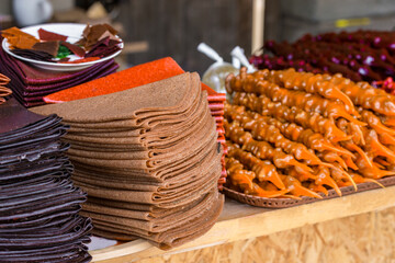 Tklapi - traditional georgian fruit pastila selling at market