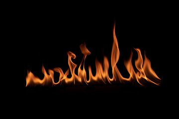 Abstract blaze fire flame texture for banner background.Texture of fire flames  on a black background. Real fiery bonfire for creative design elements