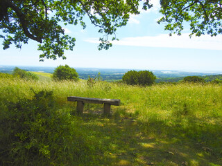 Bench with a view of the countryside and the horizon at the top