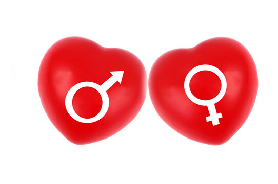 Deux coeurs avec les symboles femelle et mâle en gros plan sur fond blanc