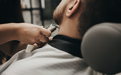 man with a beard gets a haircut