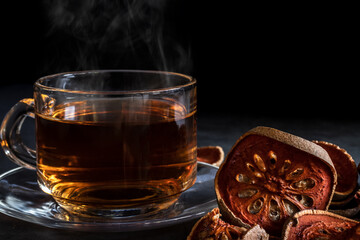 Matum tea. Bael fruit tea and slices of dried bael fruit