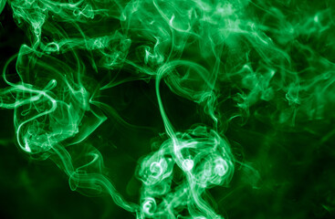 Green smoke isolated on black background. Abstraction